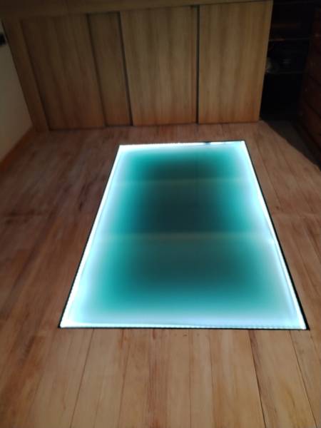 Réalisation d’un plancher vitré intégré dans un plancher bois avec éclairage LED